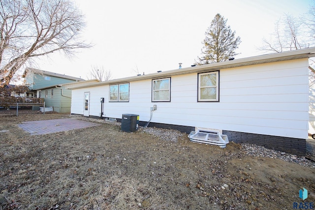 rear view of property featuring central air condition unit