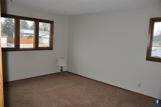 empty room featuring carpet flooring