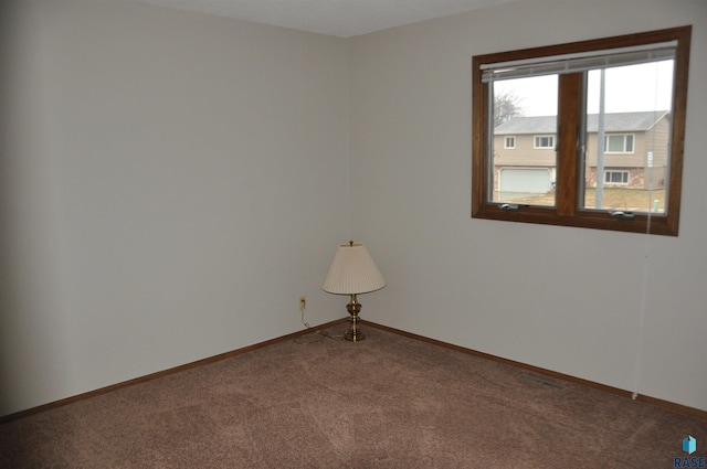 view of carpeted spare room