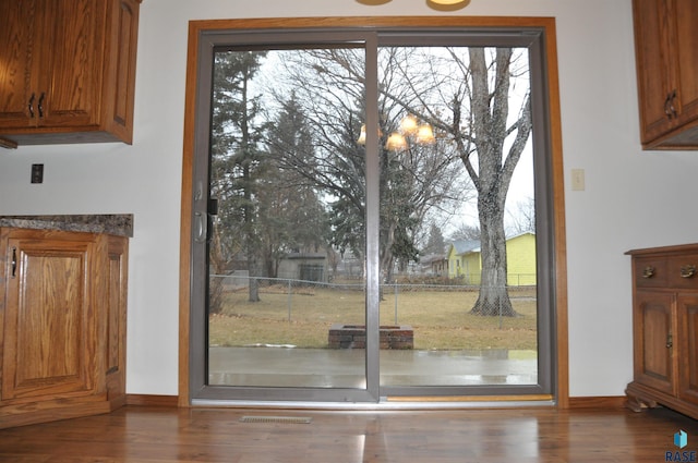 entryway with dark wood-type flooring