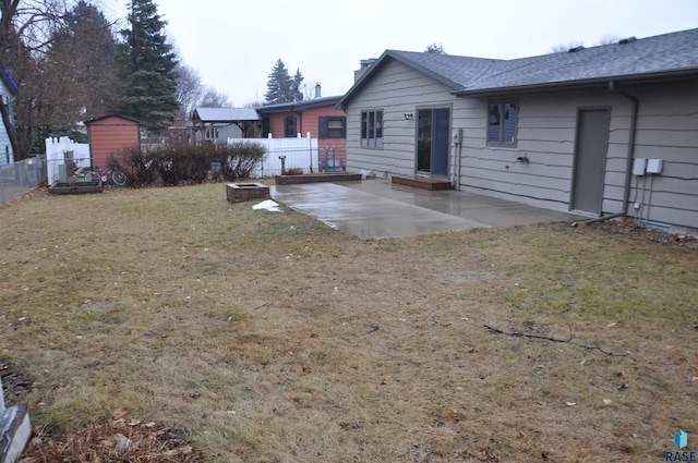 view of yard with a fire pit and a patio area