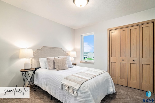 bedroom with dark carpet and a closet