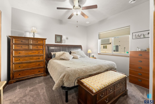 bedroom featuring dark carpet and ceiling fan