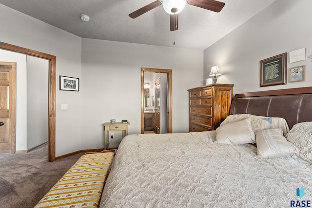 carpeted bedroom featuring a closet, ensuite bath, and ceiling fan