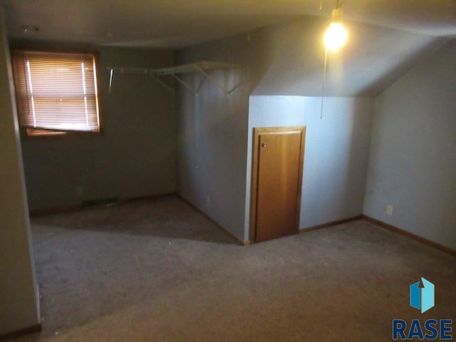 bonus room featuring carpet floors and lofted ceiling