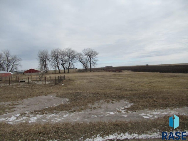 view of yard with a rural view