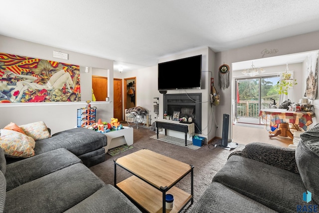 carpeted living room with a chandelier and a textured ceiling