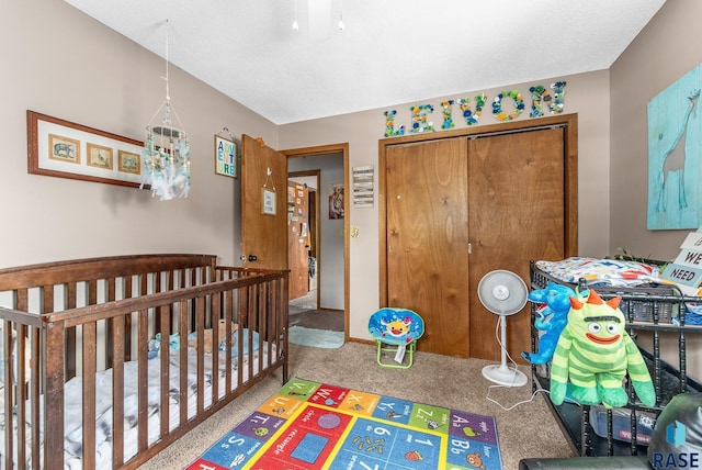 bedroom with carpet flooring and a crib