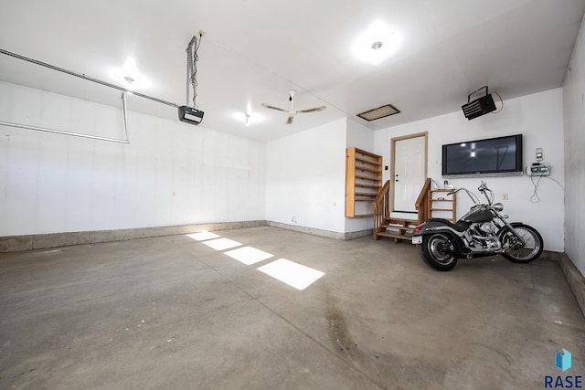 garage featuring a garage door opener