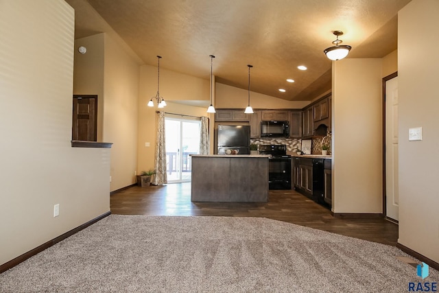 kitchen featuring pendant lighting, an inviting chandelier, black appliances, tasteful backsplash, and a kitchen island