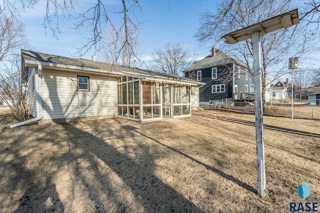 rear view of house with a sunroom