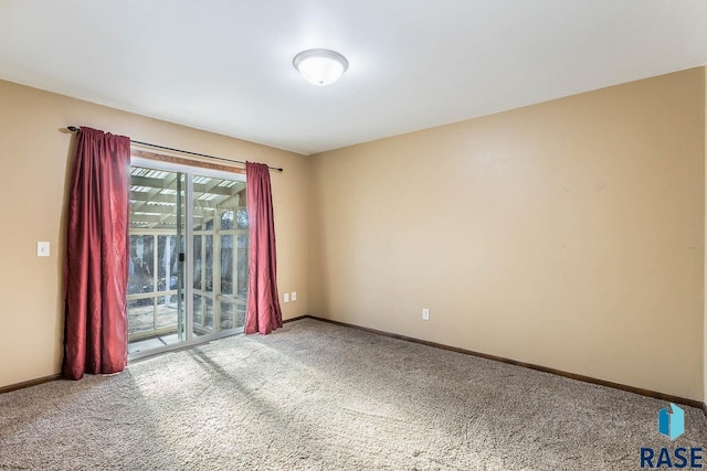 unfurnished room with carpet flooring