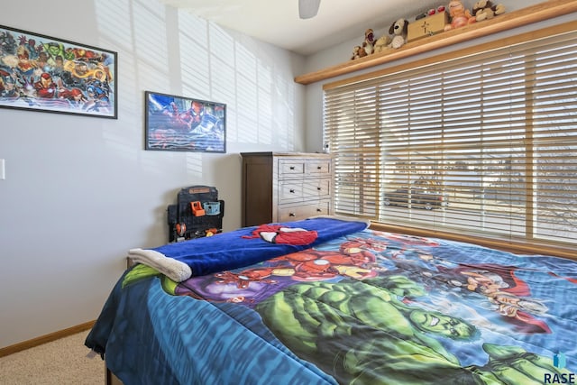 carpeted bedroom featuring ceiling fan