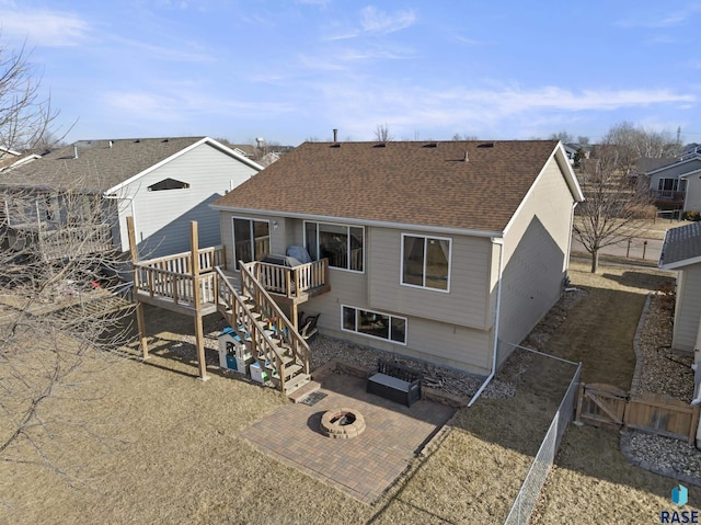 back of house featuring a fire pit, a patio area, and a wooden deck