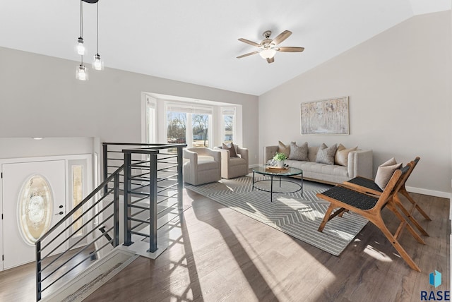 living room featuring hardwood / wood-style flooring, ceiling fan, and lofted ceiling