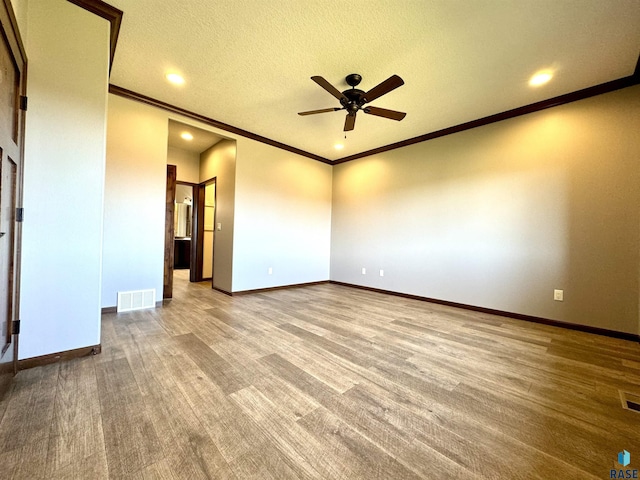 unfurnished room with ceiling fan, a textured ceiling, ornamental molding, and carpet floors