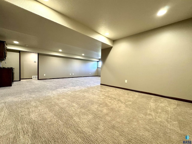 basement featuring carpet floors