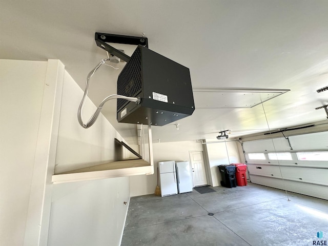 garage featuring white fridge