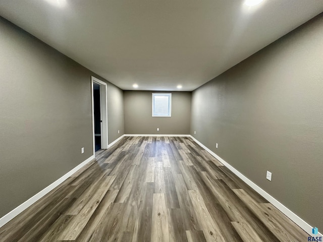 unfurnished room with dark hardwood / wood-style floors