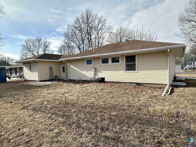 back of house with a lawn, a patio, and central air condition unit