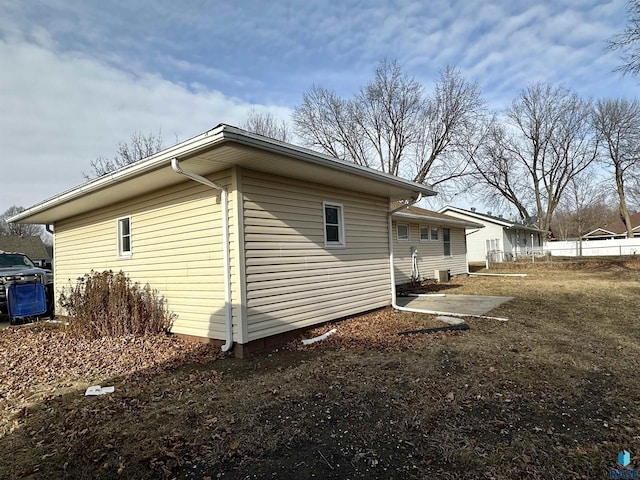 view of property exterior with central AC unit