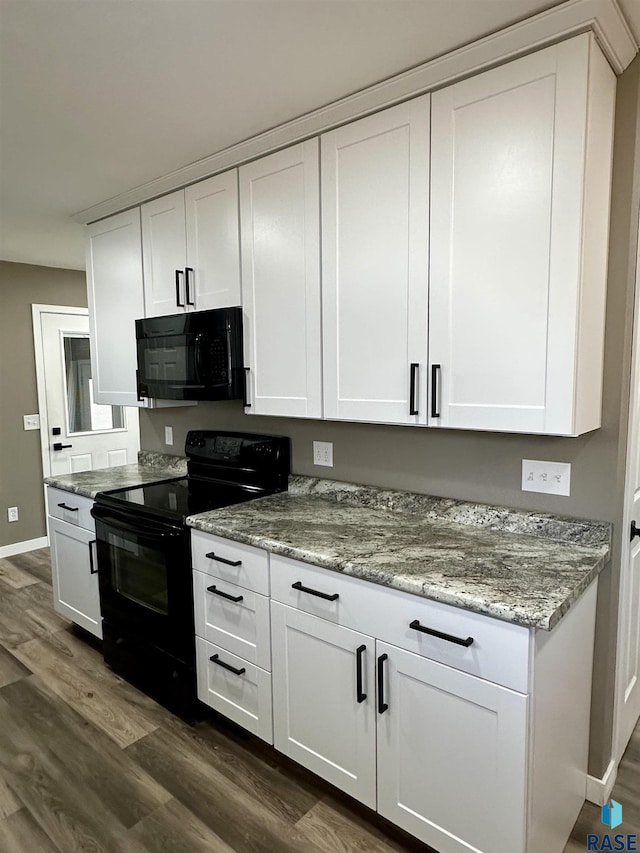 kitchen with white cabinetry, light stone counters, dark hardwood / wood-style flooring, and black appliances