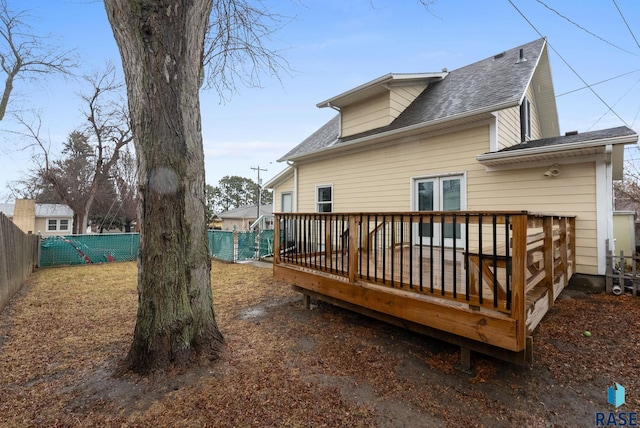 rear view of property with a wooden deck