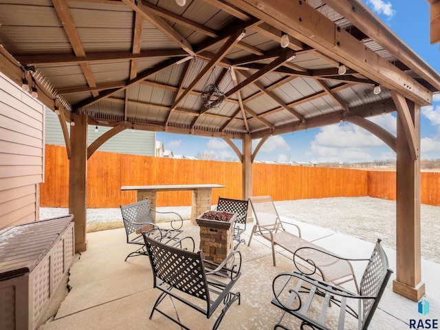 view of patio with a gazebo and a fire pit