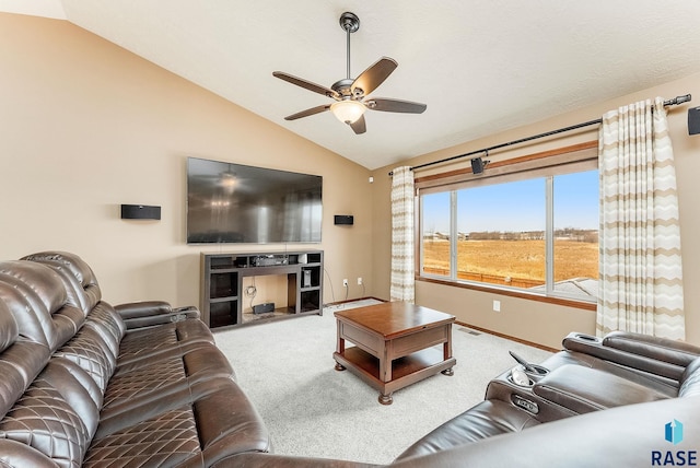 living room featuring carpet, vaulted ceiling, and ceiling fan