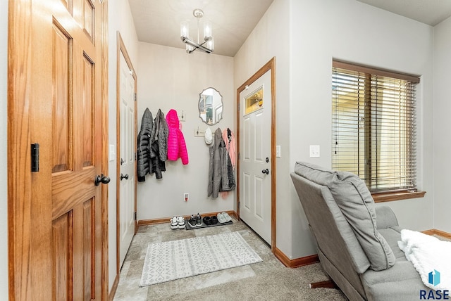 mudroom with a notable chandelier