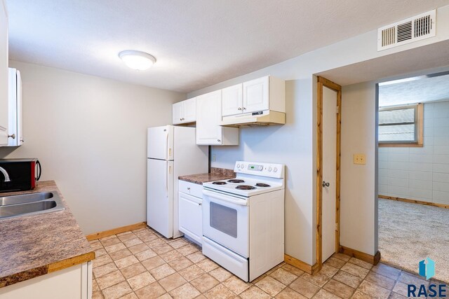 kitchen with white cabinetry, sink, light colored carpet, and white appliances