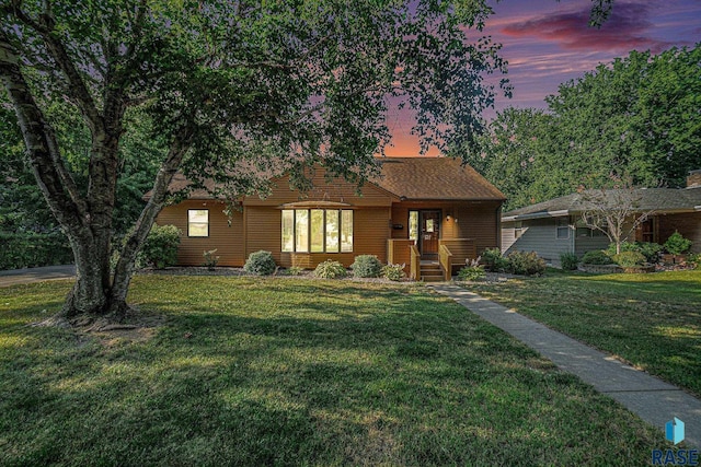 view of front of home featuring a yard