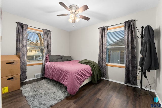 bedroom featuring dark hardwood / wood-style floors and ceiling fan