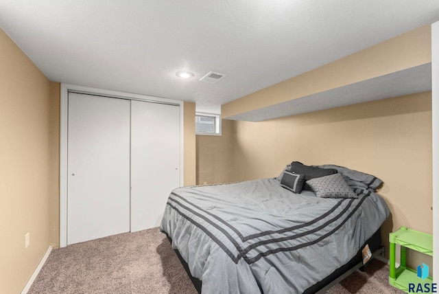 carpeted bedroom featuring a closet