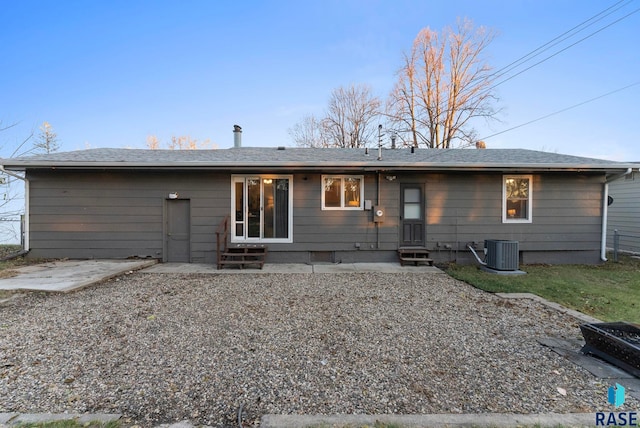 rear view of house featuring cooling unit and a patio area