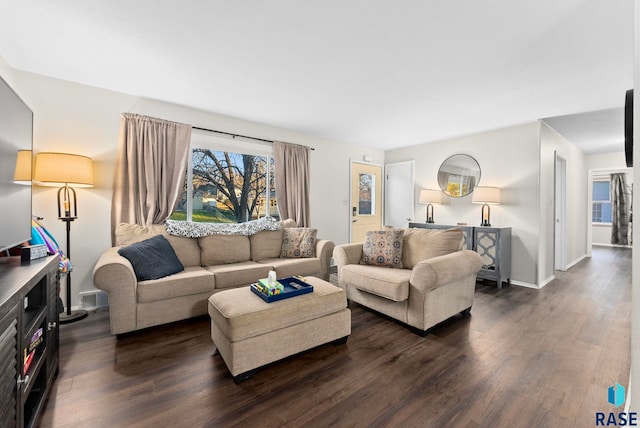 living room with dark wood-type flooring