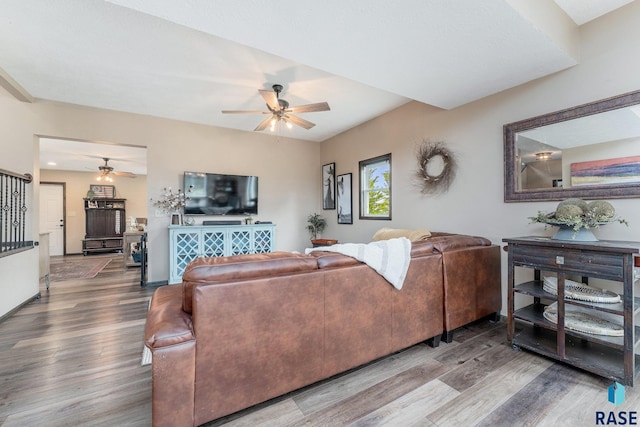 living room with hardwood / wood-style floors and ceiling fan