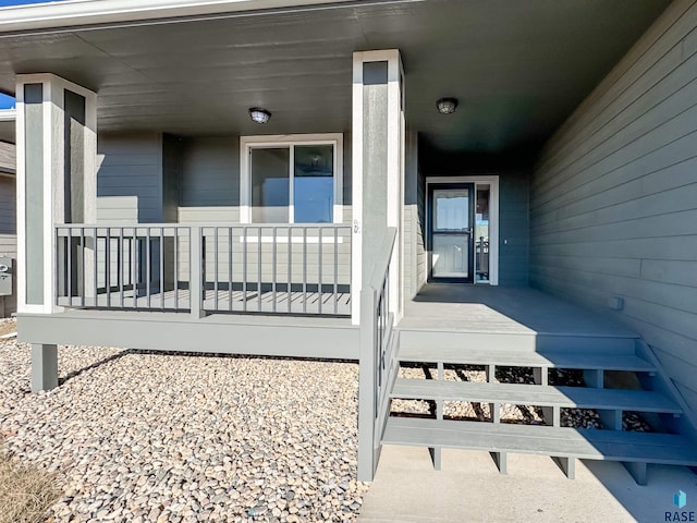 doorway to property featuring covered porch