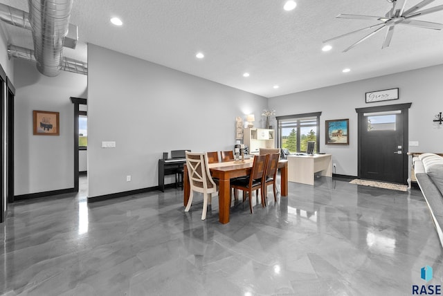 dining space featuring ceiling fan and a textured ceiling