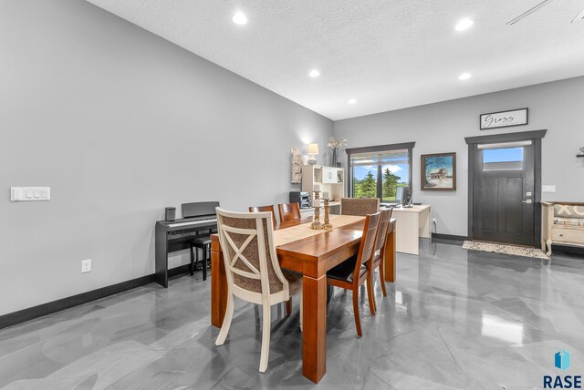 dining room with a textured ceiling