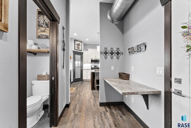 interior space with dark hardwood / wood-style flooring