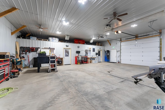 garage featuring ceiling fan and a garage door opener