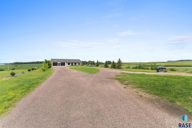 view of front of home with a rural view