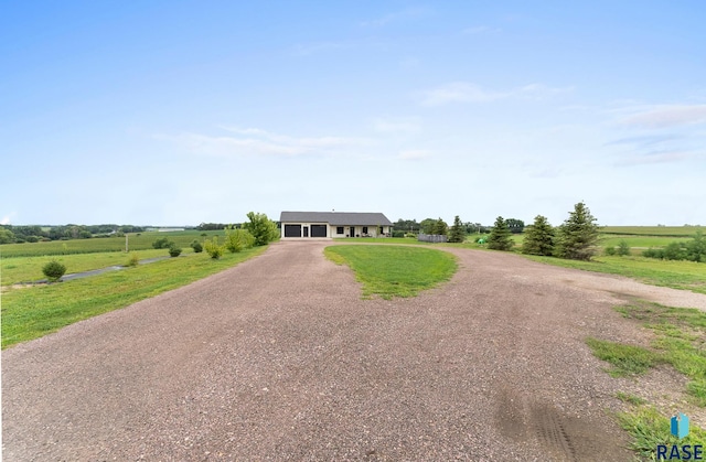 view of front of house with a rural view