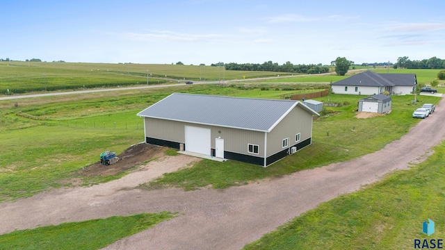 birds eye view of property featuring a rural view