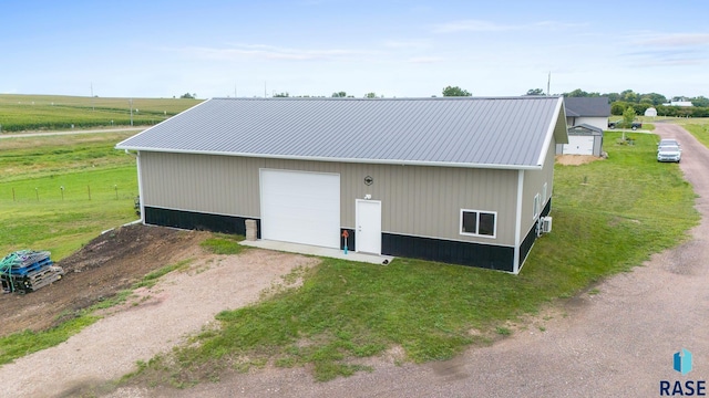 exterior space featuring a garage and an outdoor structure