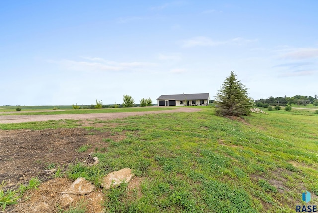 view of yard with a rural view