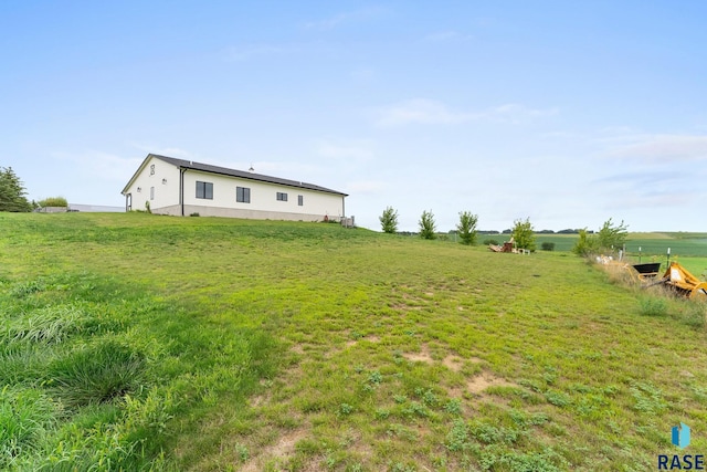 view of yard with a rural view