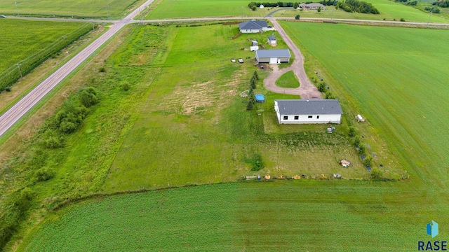 birds eye view of property with a rural view