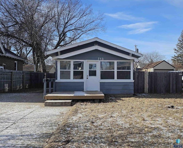 bungalow-style house with a wooden deck